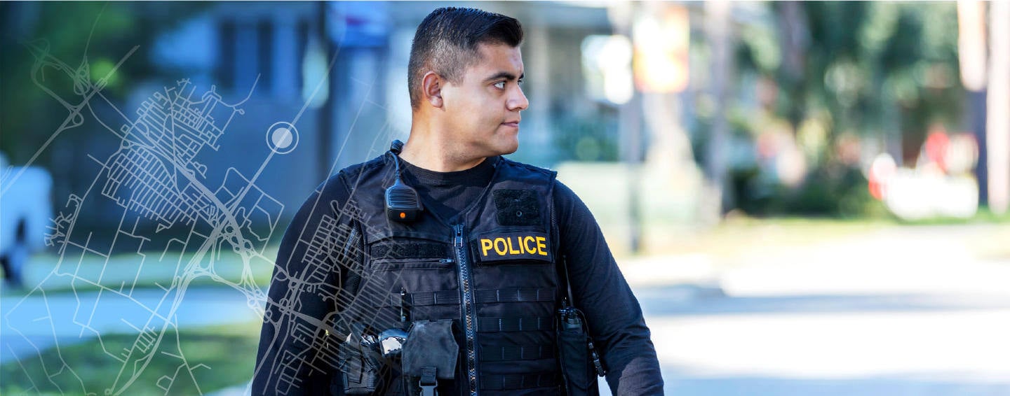 Law enforcement officer waking in the street