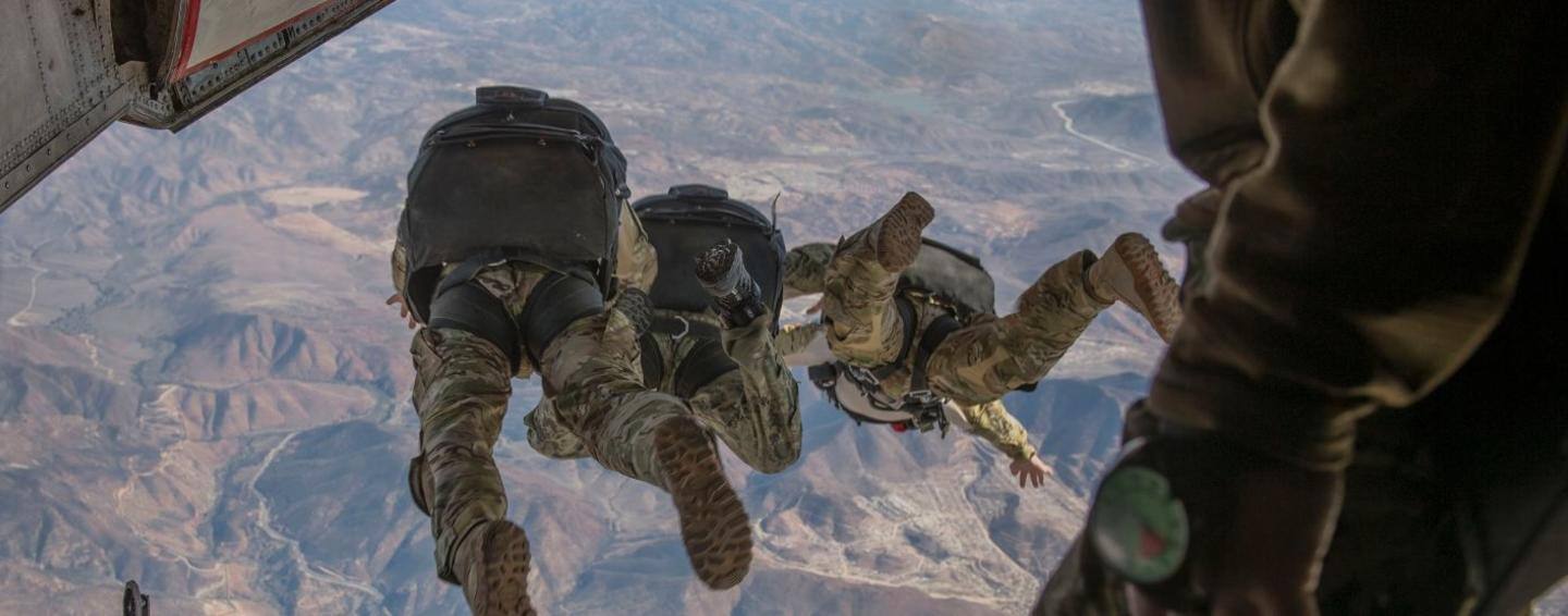 Military field officers jumping out of plane