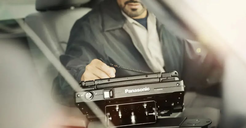 A field service technician uses a rugged device for heavy equipment repair.