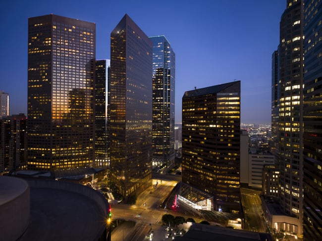 A view of downtown LA at night, where projection mapping has turned buildings into pieces of living art.