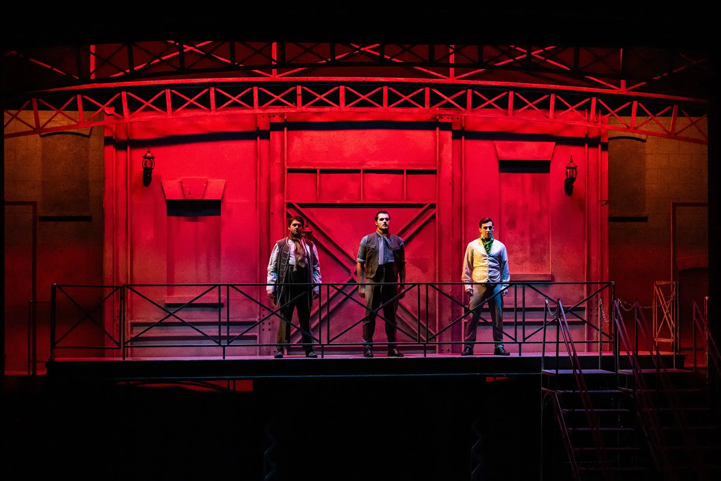 The interior of the Iris Cantor Theatre lit up in bright blue and red after Pro AV upgrade.