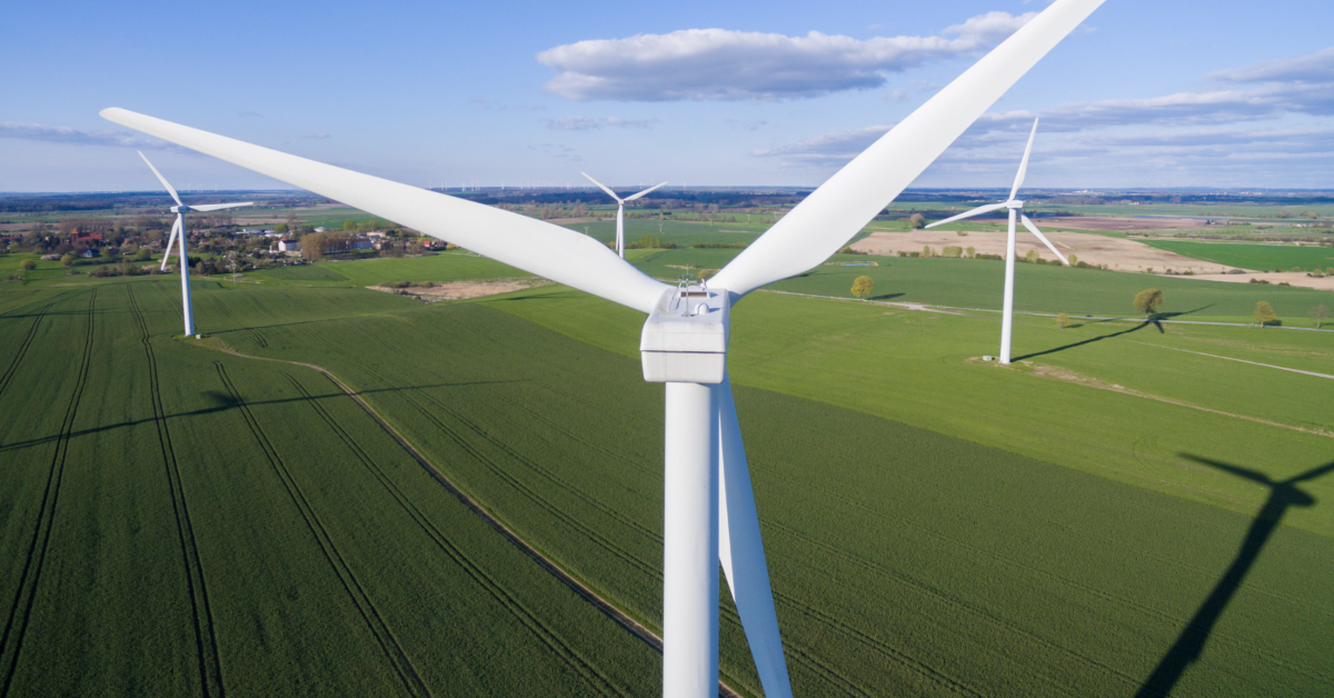 Wind turbine on a field from aerial view. Sustainable development, environment friendly concept. Wind turbine give renewable energy.